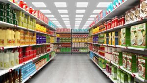 Supermarket interior with shelves full of various products.